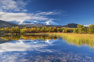 Reflection of the autumn landscape in Rondane National Park