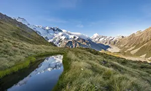 Reflection in mountain lake, view of Hooker Valley with Hooker Lake and Mount Cook