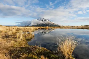 Reflection in Pouakai Tarn, stratovolcano Mount Taranaki or Mount Egmont