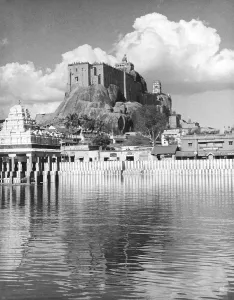 Reflection of Rock fort and temple in water pond at Tiruchinapally, Tamilnadu, India 1940's