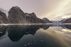 Reflection in the water, mountains and icebergs
