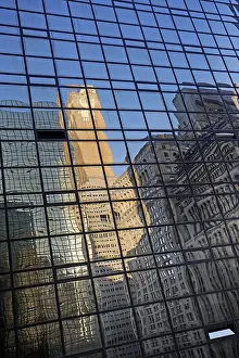 Reflections of historic classicist facades in a glass front