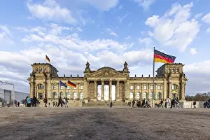 Reichstag building Berlin with German flags