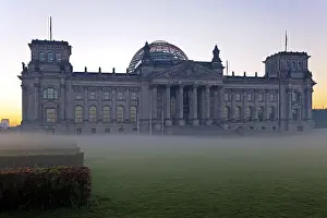 Reichstag Building at dawn with ground fog and backlighting