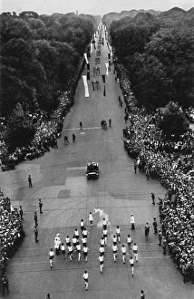 The relay with the Olympic flame on the way to the stadium