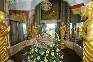 Reliquary with relics under glass in dome of tower in top of Chedi highest building in temple complex Buddhist
