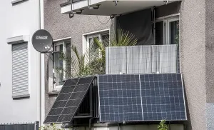 Residential building with photovoltaic modules on the balcony