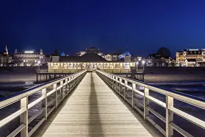 Restaurant on Ahlbeck Pier, Seebrucke Ahlbeck illuminated at dusk in the Baltic Sea on Usedom island
