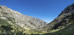 Restonica river flows at its source through mountain valley