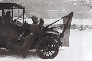Revolutionaries hung at a car with the red flag