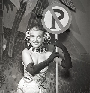 Revue in the 1950s. Beautiful actress Mary Rapp, 1920-1964, pictures at a non parking sign in the revue Robinson Crazy 1953. Sweden Kristoffersson ref BM42-7