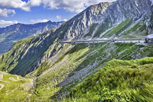 Right gallery with modern route road from for south ramp of pass summit Gotthardpass Alpine pass road towards Airolo