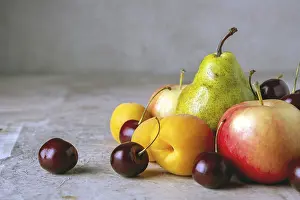 Ripe fruits on a beige background