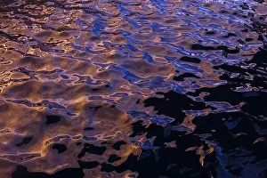 Rippling water creates abstract shapes and textures in this photograph from La Pared
