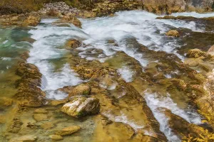 The Riss creek flowing through an autumnal landscape in the Eng valley
