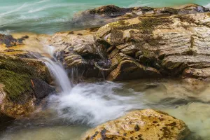 The Riss creek flowing through an autumnal landscape in the Eng valley