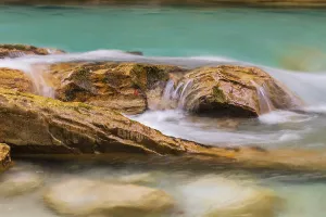 The Riss creek flowing through an autumnal landscape in the Eng valley