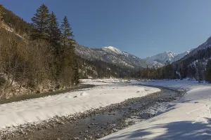 The Riss creek flowing through a snow covered landscape in the Eng valley