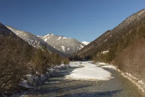 The Riss creek flowing through a snow covered landscape in the Eng valley