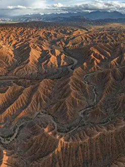 River bed runs through a landscape of eroded hills
