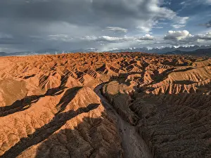 River bed runs through a landscape of eroded hills