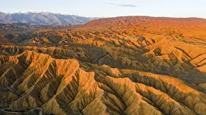 River bed runs through a landscape of eroded hills