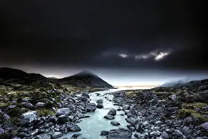 River course and rocky landscape under a dramatic sky in Hocker Valley