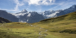 River meanders, behind snow-covered Schreckhorn and Eiger