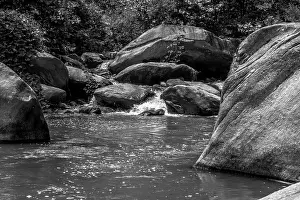 River stream flowing over rock formations in the mountains