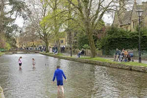 River Windrush, people, children playing in the water