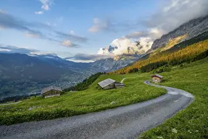 Road, alpine huts and alpine meadows