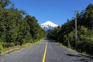 Category Mountain Landscapes Prints: Road leading to the snowcapped volcano Villarrica