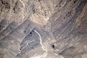 A road leads up a mountain consisting of several ridges