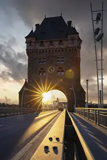 A road or motorway leads through an old historic city gate