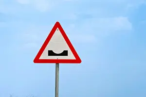 Road traffic cautionary signs showing dangerous dip