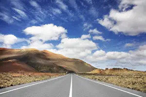 Road through the volcanic landscape in the Timanfaya National Park