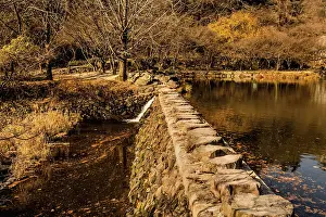 Framed Print : Rock footbridge across small lake on autumn morning Framed Print : Rock footbridge across small lake on autumn morning