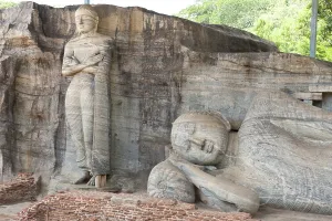 Rock reliefs, a standing and a reclining Buddha