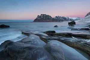 Rock in the sea, back mountains