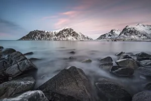 Rocky coast, mountains in the background