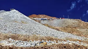 Rocky mountain with loose gravel and blue sky