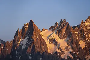 Rocky pointed mountain peaks at sunset