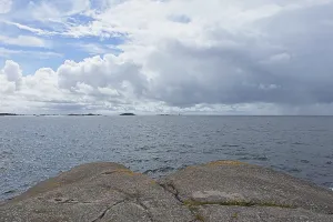 Rocky seashore on the island of Jussaro in cloudy summer weather