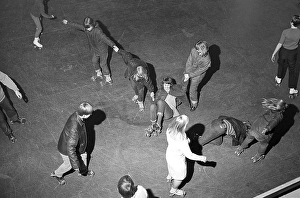 Roller skate fun in the 1960s. Interior of a roller disco with people roller skating