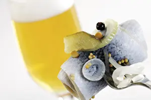 Rollmops (rolled, pickled herring filet) and a glass of beer