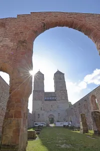 Romanesque St. Mary's Collegiate Church backlit with archway
