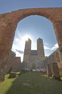 Romanesque St. Mary's Collegiate Church backlit with archway