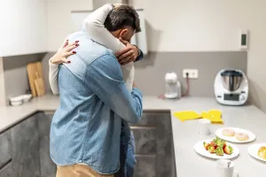 Romantic couple embracing in a cozy kitchen