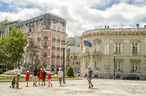 Romantic Lisbon street with the typical old buildings and new buildings