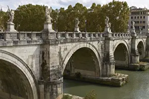 ROME, ITALY - SEPTEMBER 28, 2010: Tourists Crossing the Bridge In Front Of Castel Sant'Angelo in Rome Italy<br> ROME